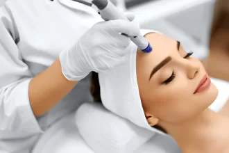 A woman receiving a facial dermabrasion treatment, enhancing her skin's texture and appearance in a serene spa setting.