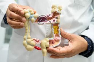 Illustration of a healthy gut with icons representing probiotics, such as yogurt, supplements, and bacteria, emphasizing gut health.