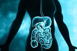 An anatomical illustration of the human body highlighted in blue, focusing on the area of intestinal atresia repair.