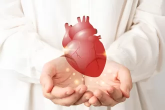 A visual representation of heart transplant costs, featuring a medical professional holding a heart model and a cost comparison chart.