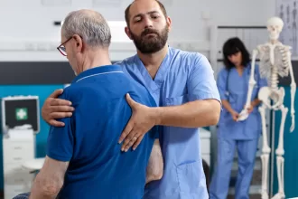 Surgeon performing spinal cord tumor surgery in an operating room